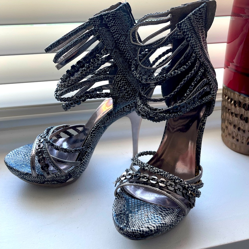 Ladies size 8 snake print and chain heels.